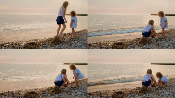两个小女孩在日落海滩上玩耍