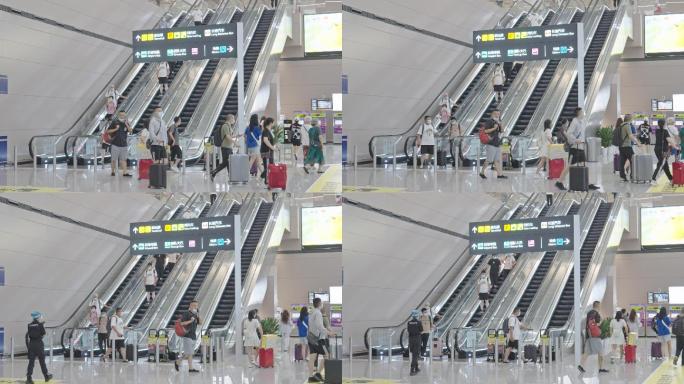 4K正版-天府机场地铁站乘坐扶梯的旅客