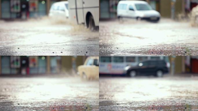 轿车在洪水泛滥的街道上翻过一个大水坑，溅起了水花