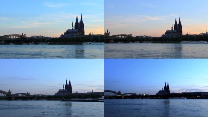 日落Nber K？在莱茵河上的一艘船和月光照亮的城市前