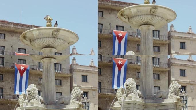 古巴哈瓦那的详细信息。旧金山大教堂附近的喷泉和古巴国旗