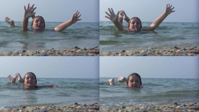 为了快乐，女孩在海里挥手舞脚。