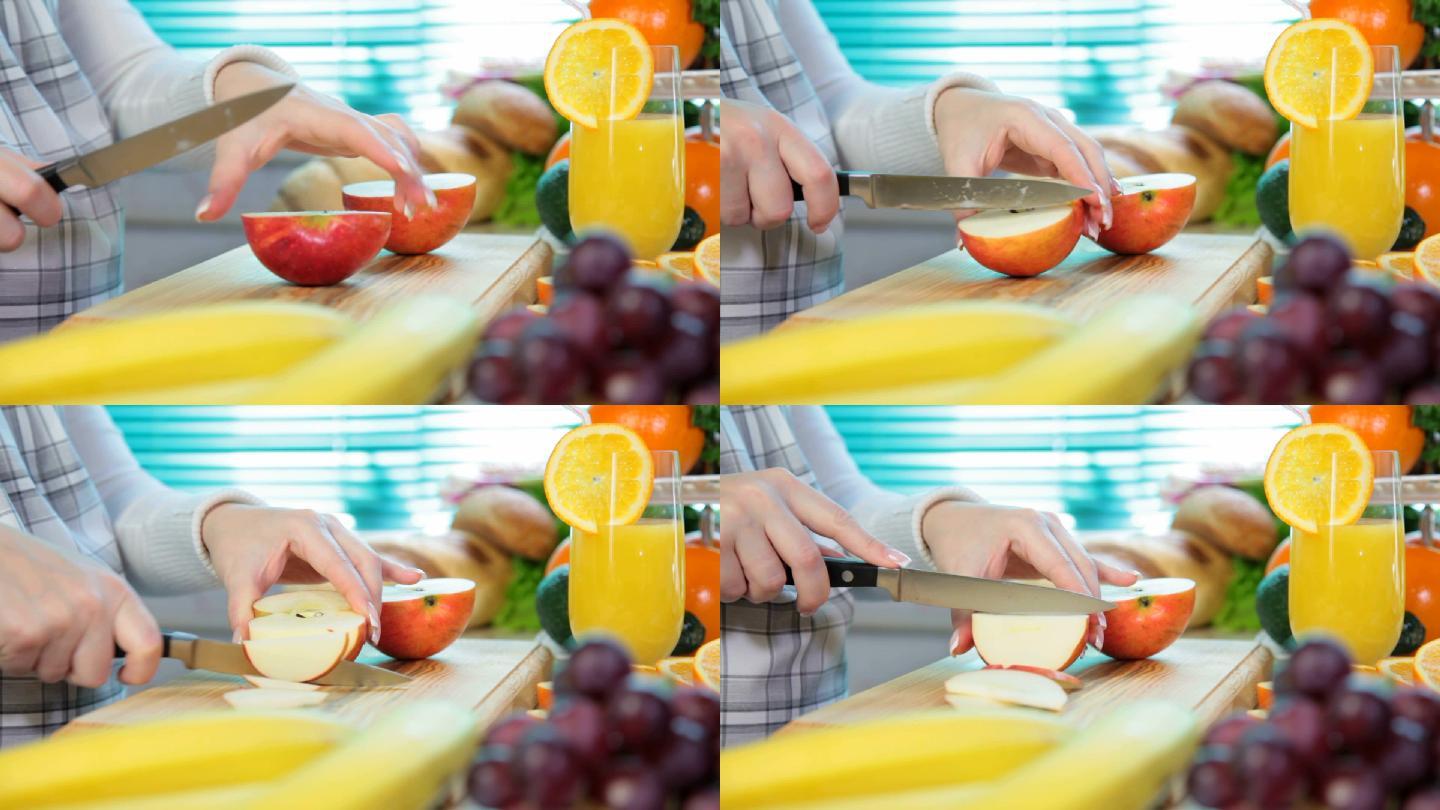 厨房里女人们用手切红苹果