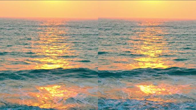 航拍日出照在海面上波光粼粼的画面