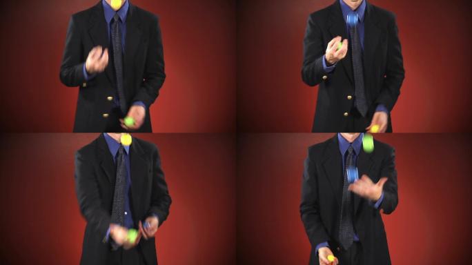 一位身着西装的匿名商人在红色背景前玩了3个球。也可提供偏心版本。
