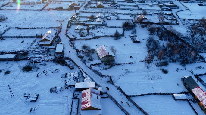 航拍大兴安岭寒冬山村雪景