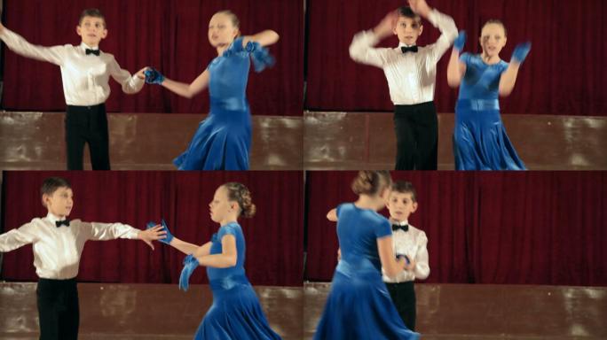在舞厅跳摇摆舞的9岁男孩和女孩。自由度