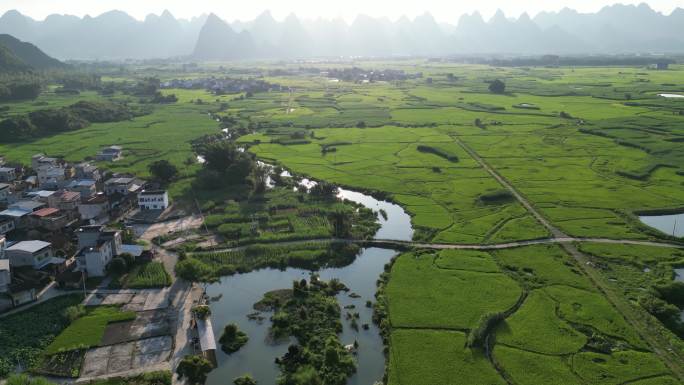 航拍大地村庄小路小河乡村农业田园稻田风景