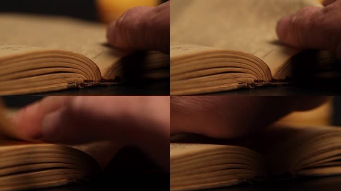人的手翻过书的一页。