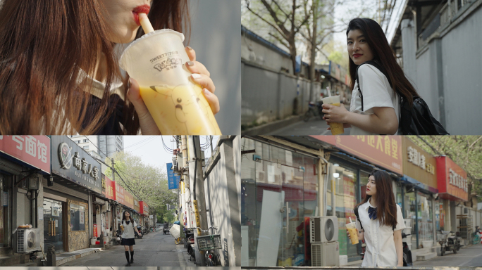 学生走在城市破旧街道喝奶茶