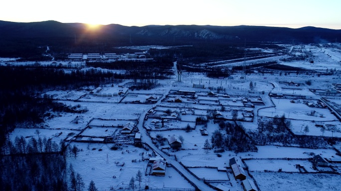 航拍大兴安岭寒冬山村雪景