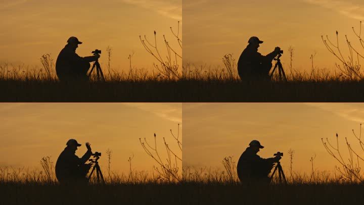 摄影师在夕阳下的剪影。