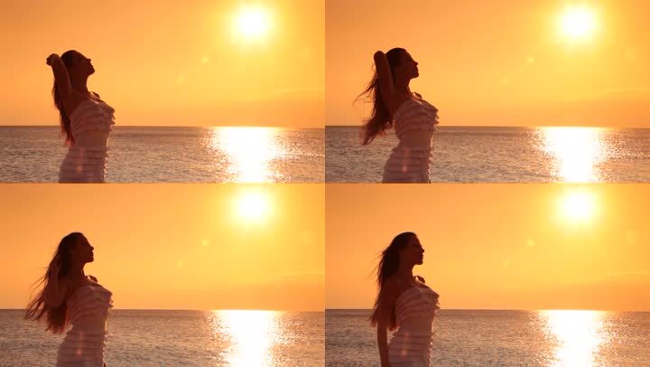 在海边欣赏日落的女人
