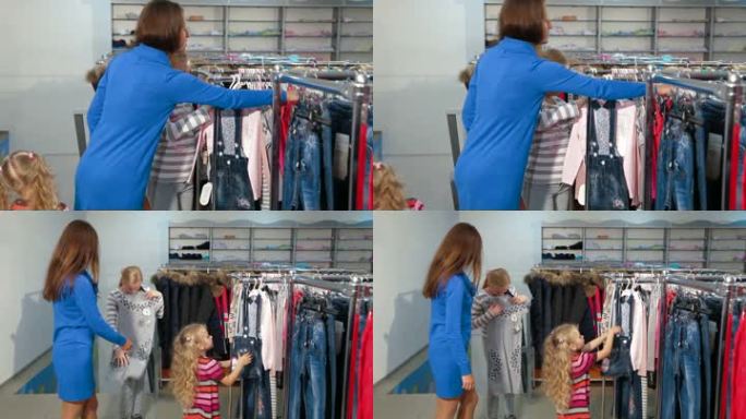 母亲带着两个女儿在一家服装店买衣服，看起来像是束腰毛衣、牛仔裙