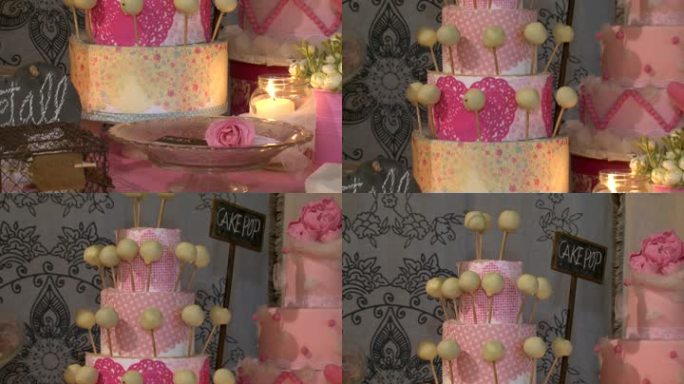 一套巧克力饼干，鲜花，蛋糕和蜡烛。婚礼配饰以柔软、优雅和粉色呈现。庆祝活动的装饰：特别活动、聚会或生