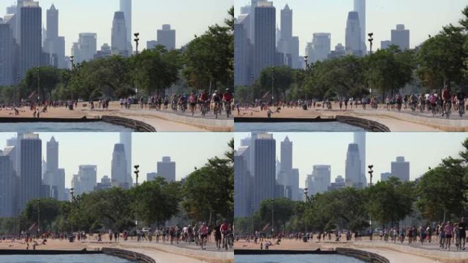 以芝加哥天际线为背景的湖岸小道上的跑步者和自行车手