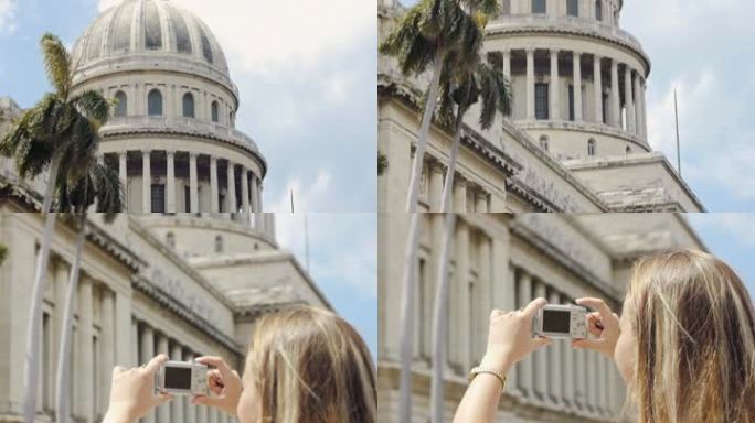 古巴哈瓦那一位年轻的金发女郎用数码相机拍照