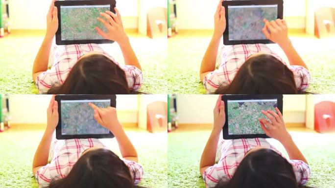 少女在数字平板电脑上搜索地图