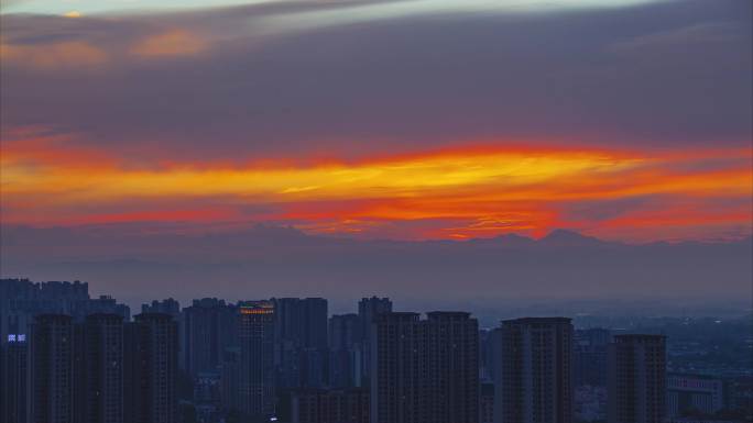 眉山市东坡城区夕阳、雪山延时视频