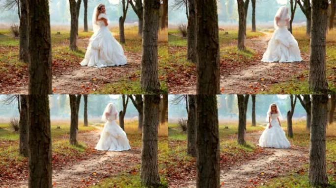 新娘在秋天的公园散步