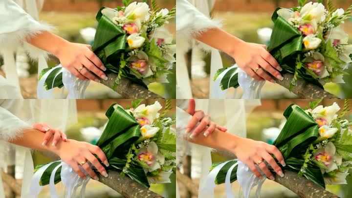新娘&敏锐；拿着花束的手