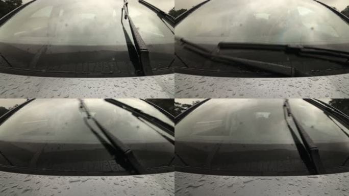 大雨中在潮湿道路上驾驶汽车的男子