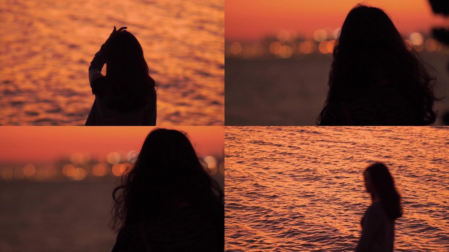 海边夕阳下唯美女性背影