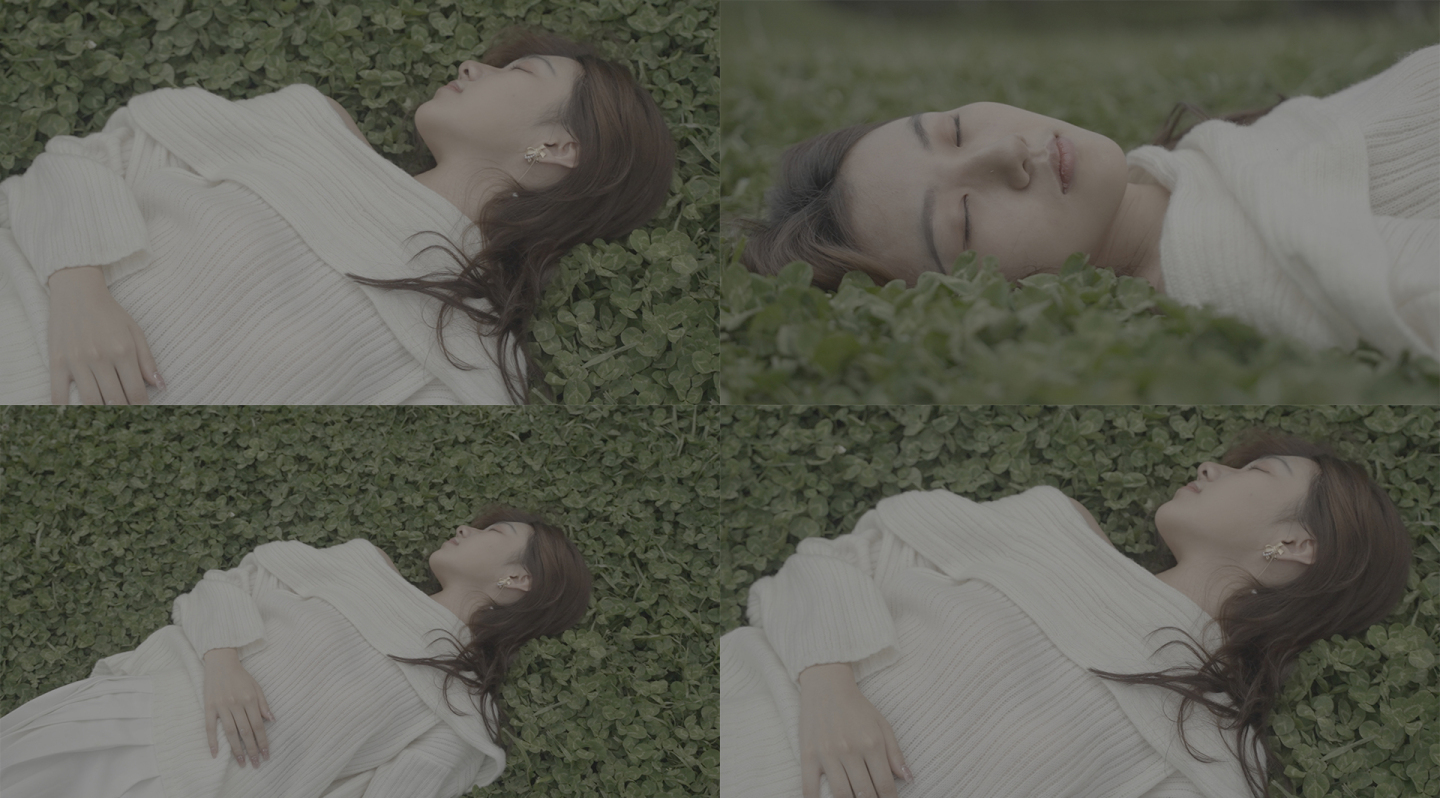 文艺少女躺在草地上慢慢睁开眼睛