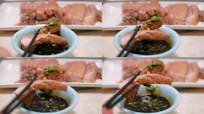筷子夹肉吃羊肉蘸水