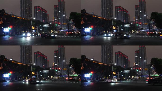城市夜景红绿灯路口左转的汽车