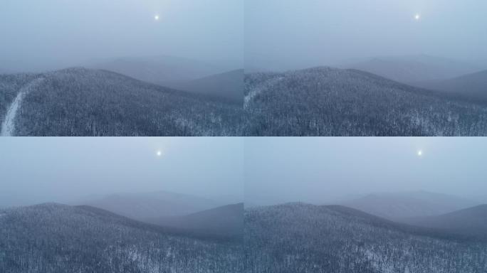 航拍下雪时的山林雾凇
