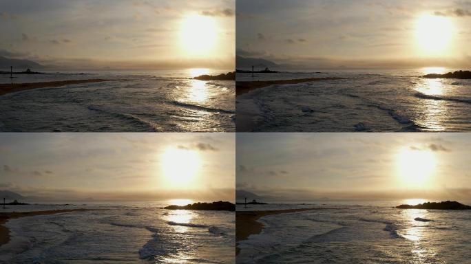 日出日落太阳光芒沙滩海边大海潮水海浪航拍