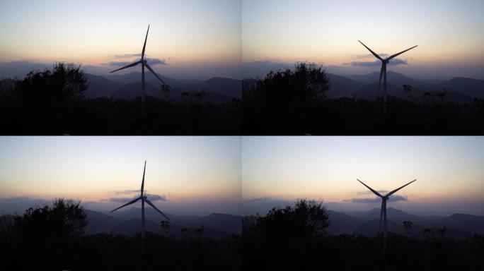 夕阳下的电力风车在旋转