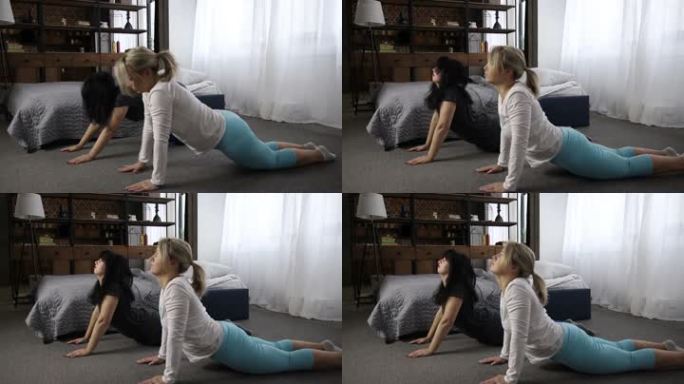 穿着运动服的休闲女性在家练习瑜伽