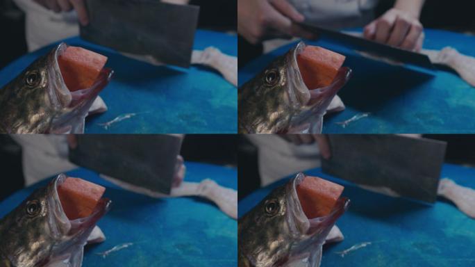 厨师使用菜刀将鱼切菱形刀段