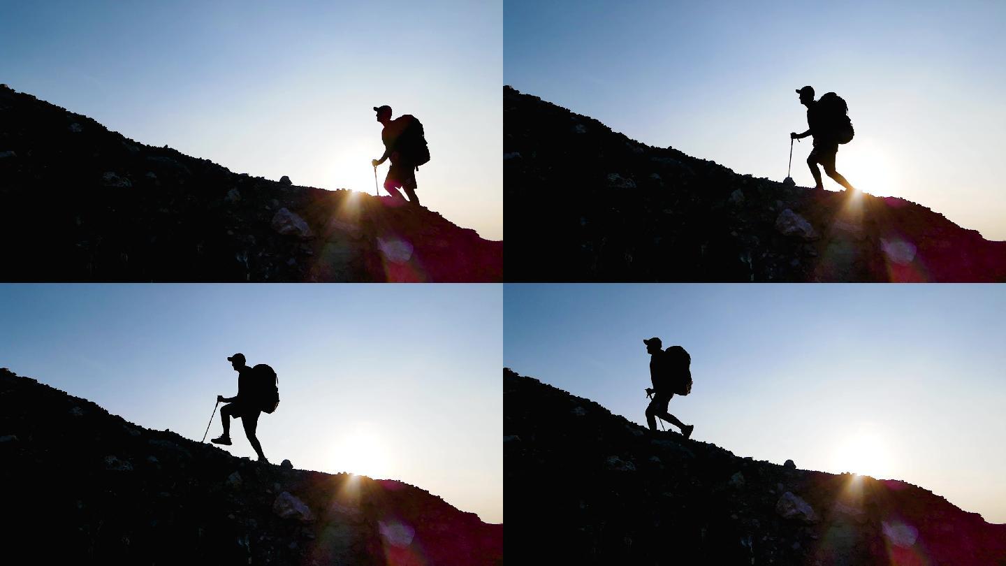 攀登者勇攀高峰登山人物剪影成功登顶概念