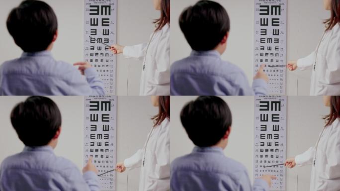 医生给小男孩测视力