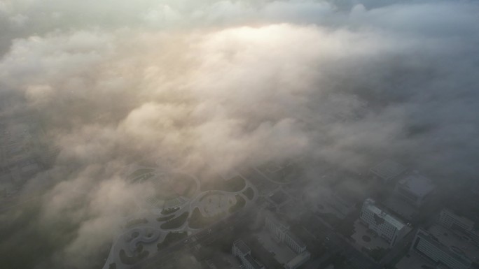 航拍俯瞰夕阳云雾之下的荣成市政府广场
