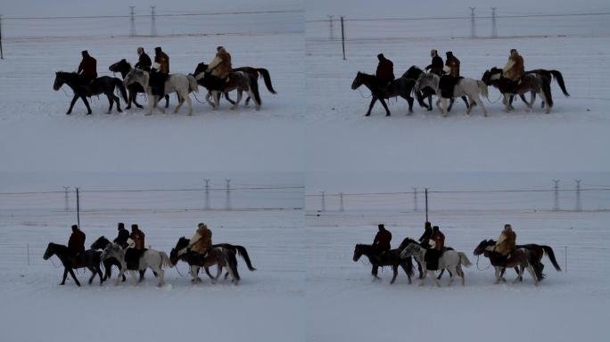 牧民骑马在冬季草原上