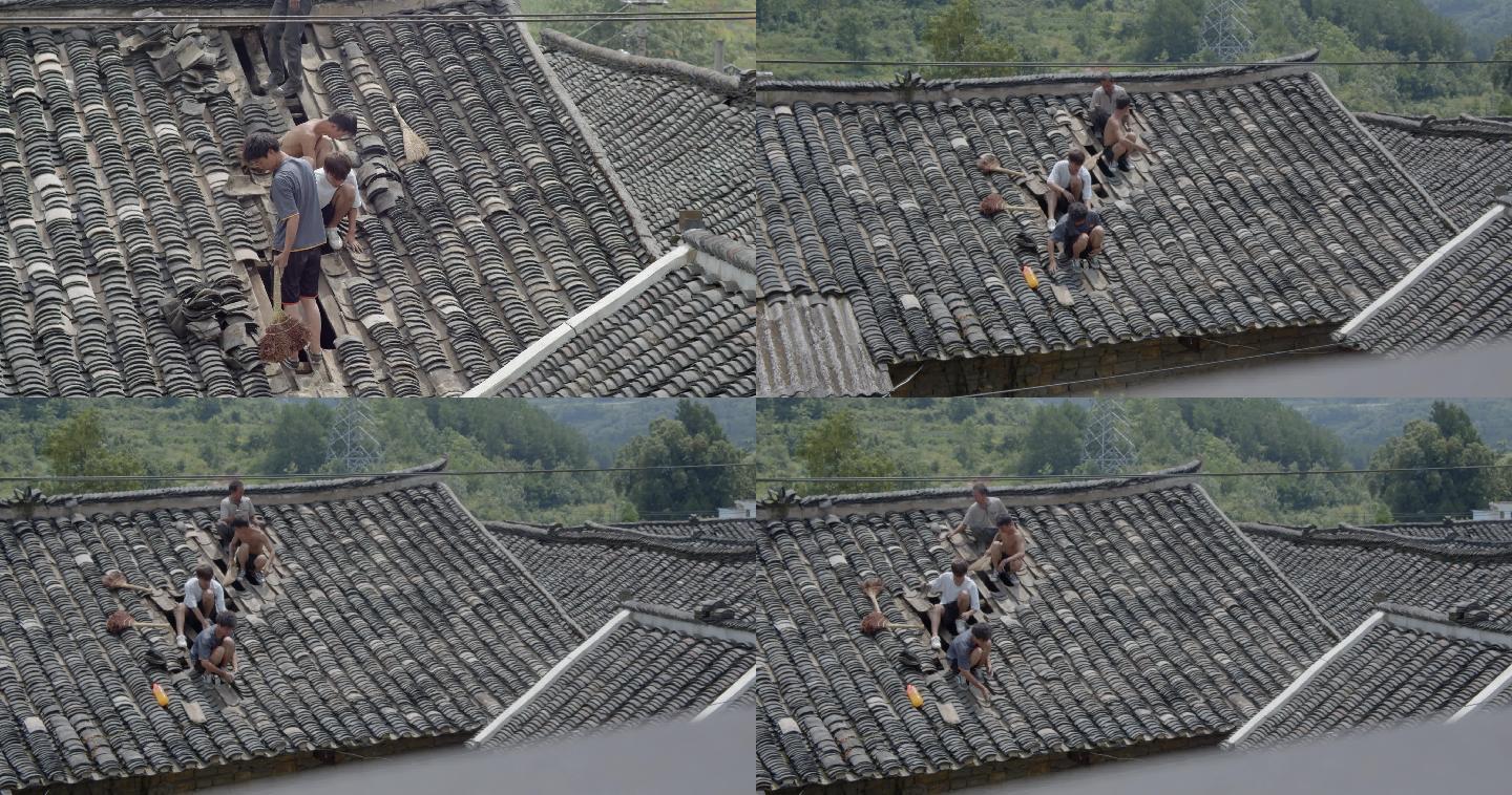 农民在屋顶捡瓦片维修瓦房