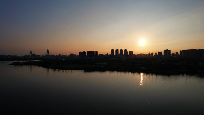 海南自贸港海口清晨日出城市建筑剪影航拍
