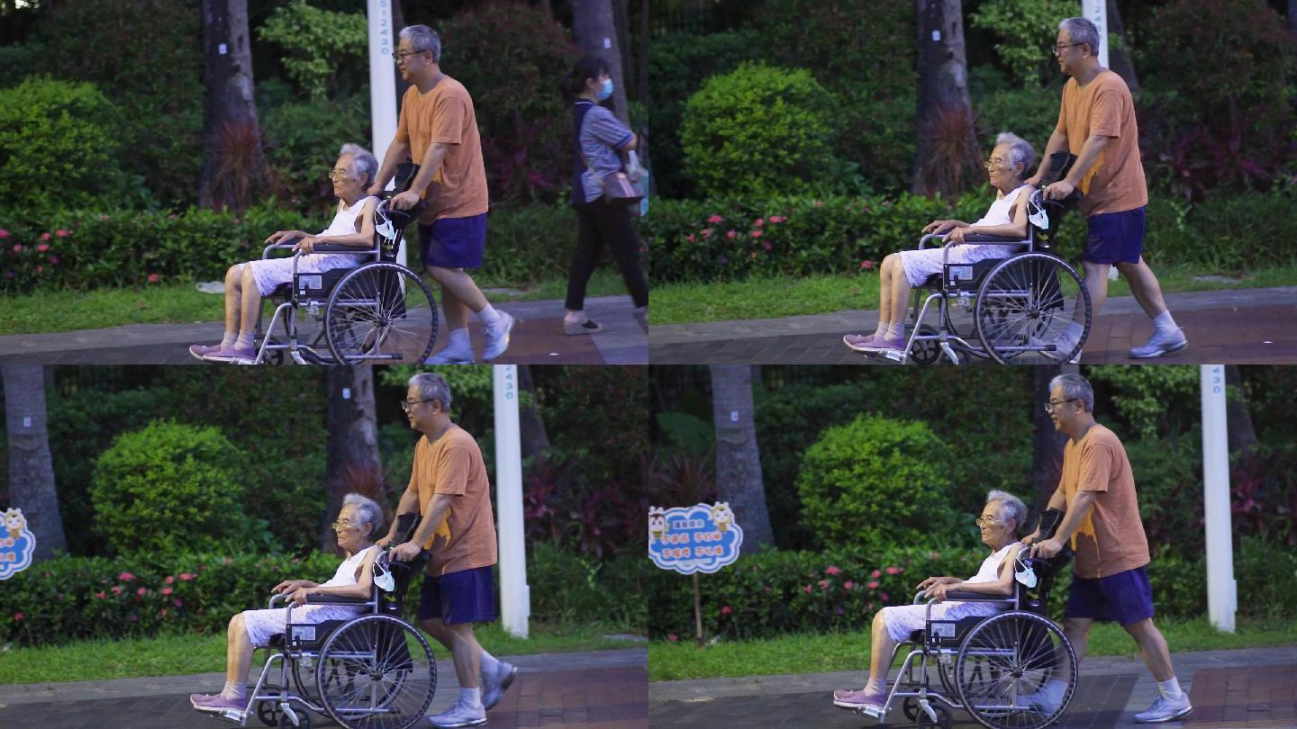 傍晚老人推轮椅散步
