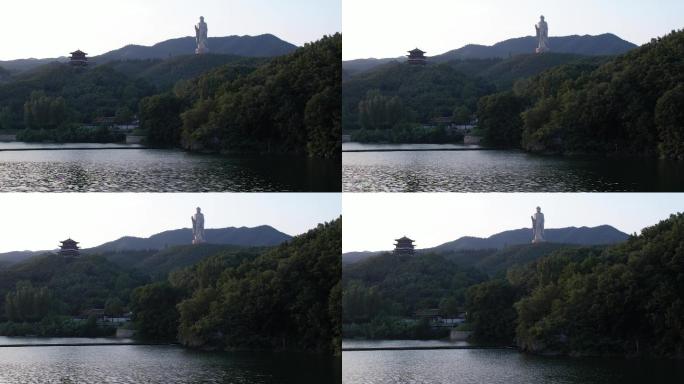 湖面寺庙山林大佛前移