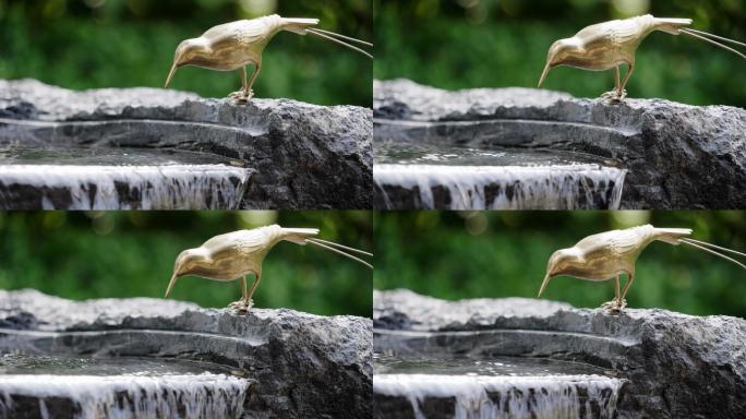 小区公园园林景观水池边小鸟塑像