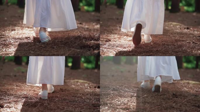 唯美白裙女生逆光行走脚步特写意境概念素材
