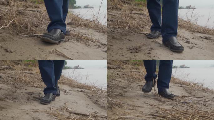 穿皮鞋沙地河边行走步伐