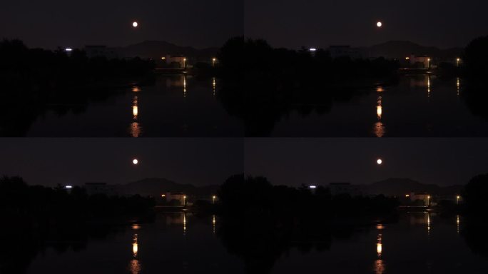 城市夜晚河面上的月亮