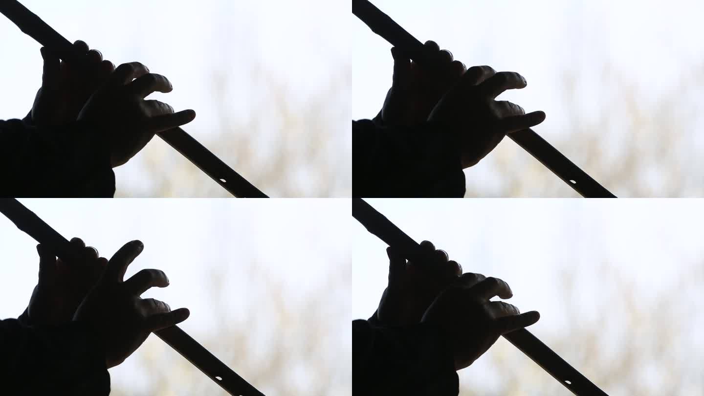 传统音乐乐器竹箫洞箫吹箫手特写剪影实拍