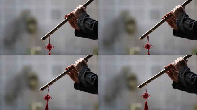传统乐器竹箫洞箫吹箫手特写中国结中国风