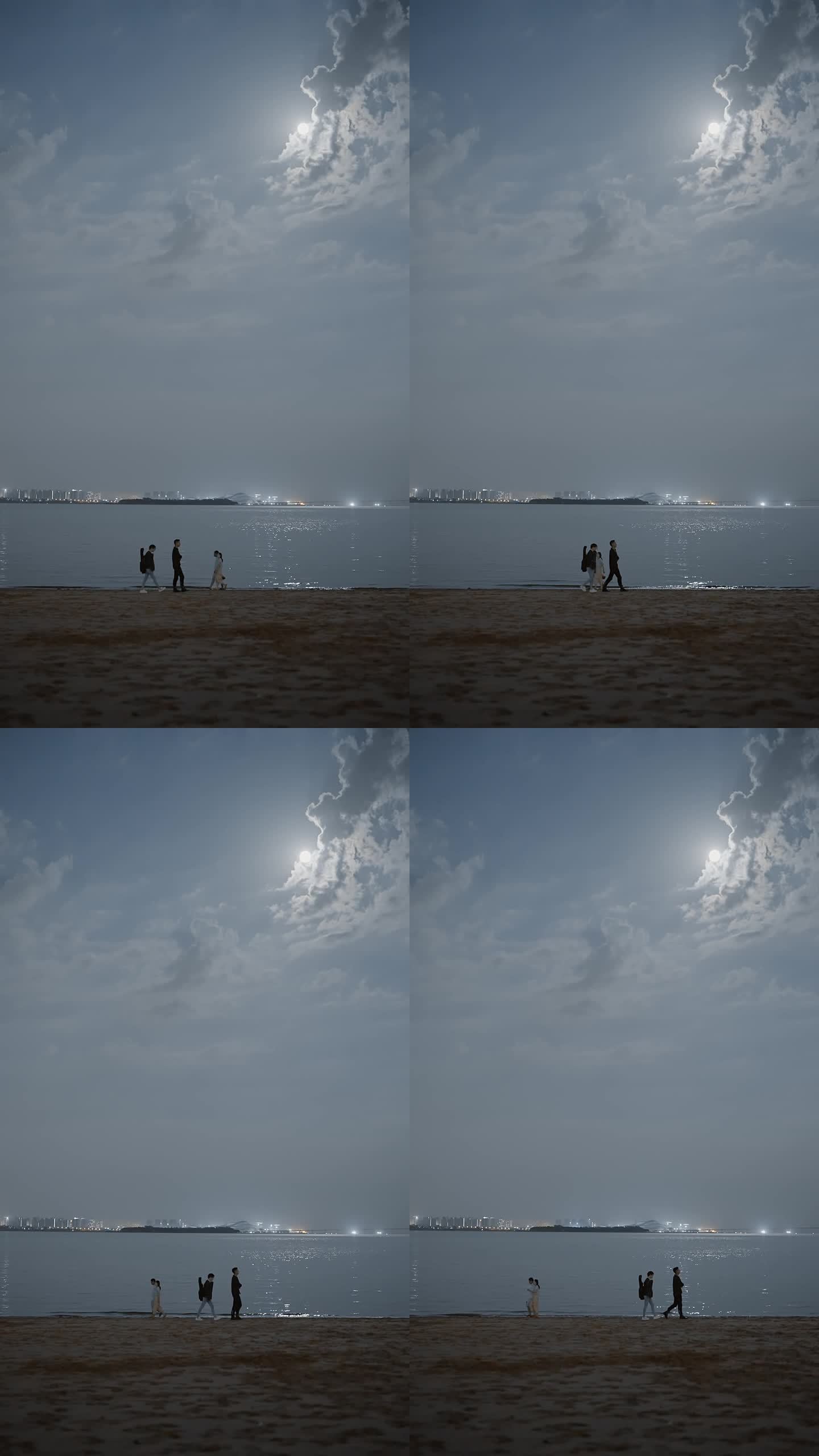 月光光照在海面上有几对情侣在海边散步